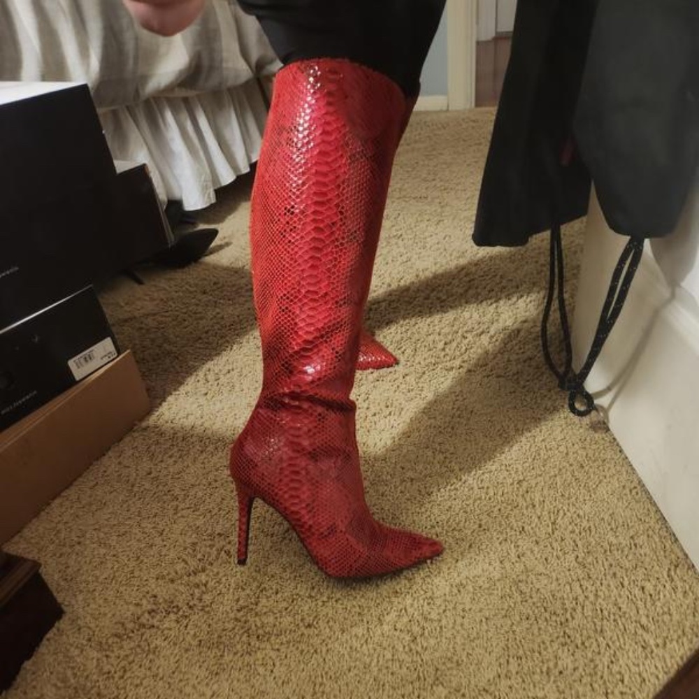 Red snake print knee high boots
